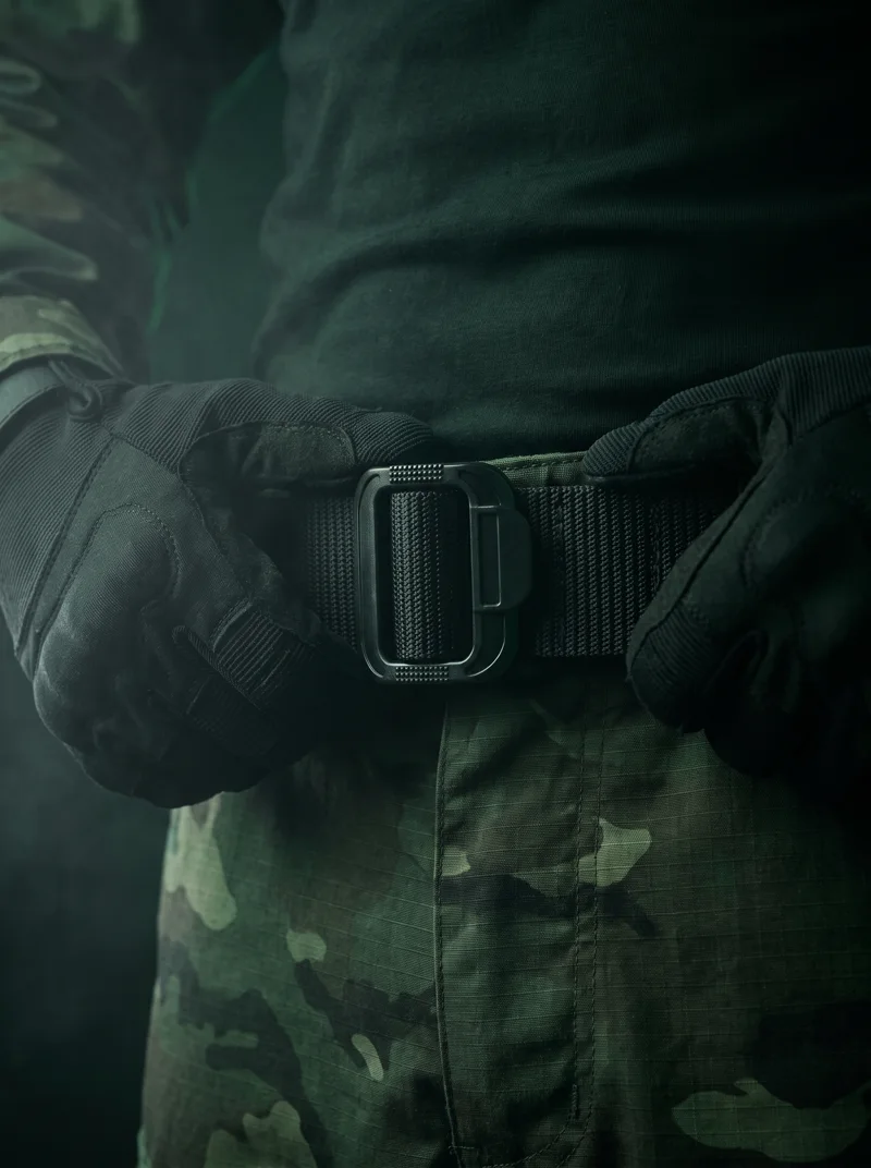 Fastening a black tactical duty belt